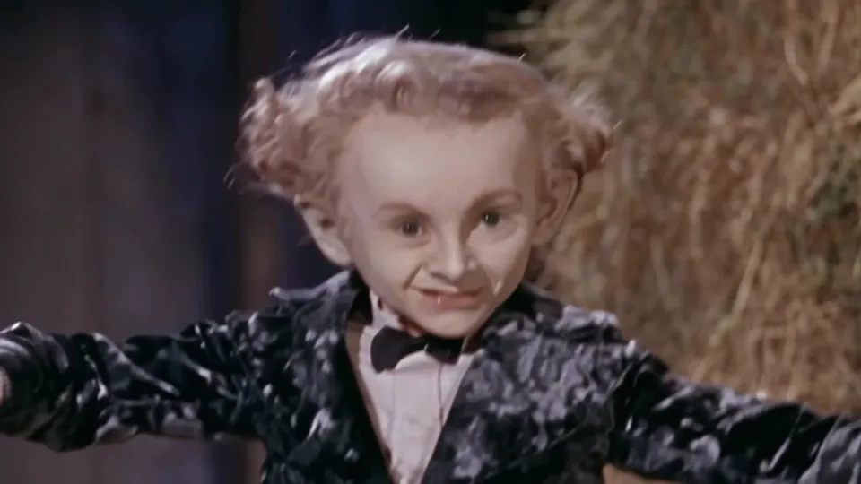 Rumpelstiltskin AI clip still: the dancer tiptoes side to side with arms spread wide across the straw