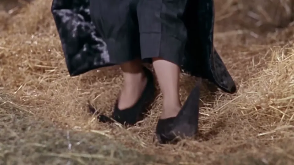 Rumpelstiltskin AI clip still: close-up of pointy curled-toe shoes tiptoeing on the hay